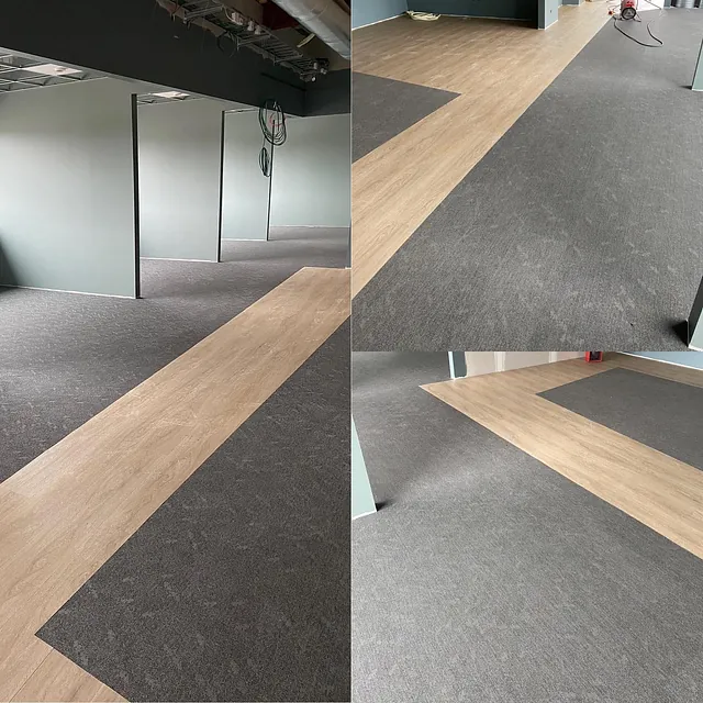 Kontorlokale under oppussing med gulv lagt i kombinasjon av trelook og mørk grå teppeflis.
